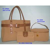 Handbag with vanity and cosmetic bag